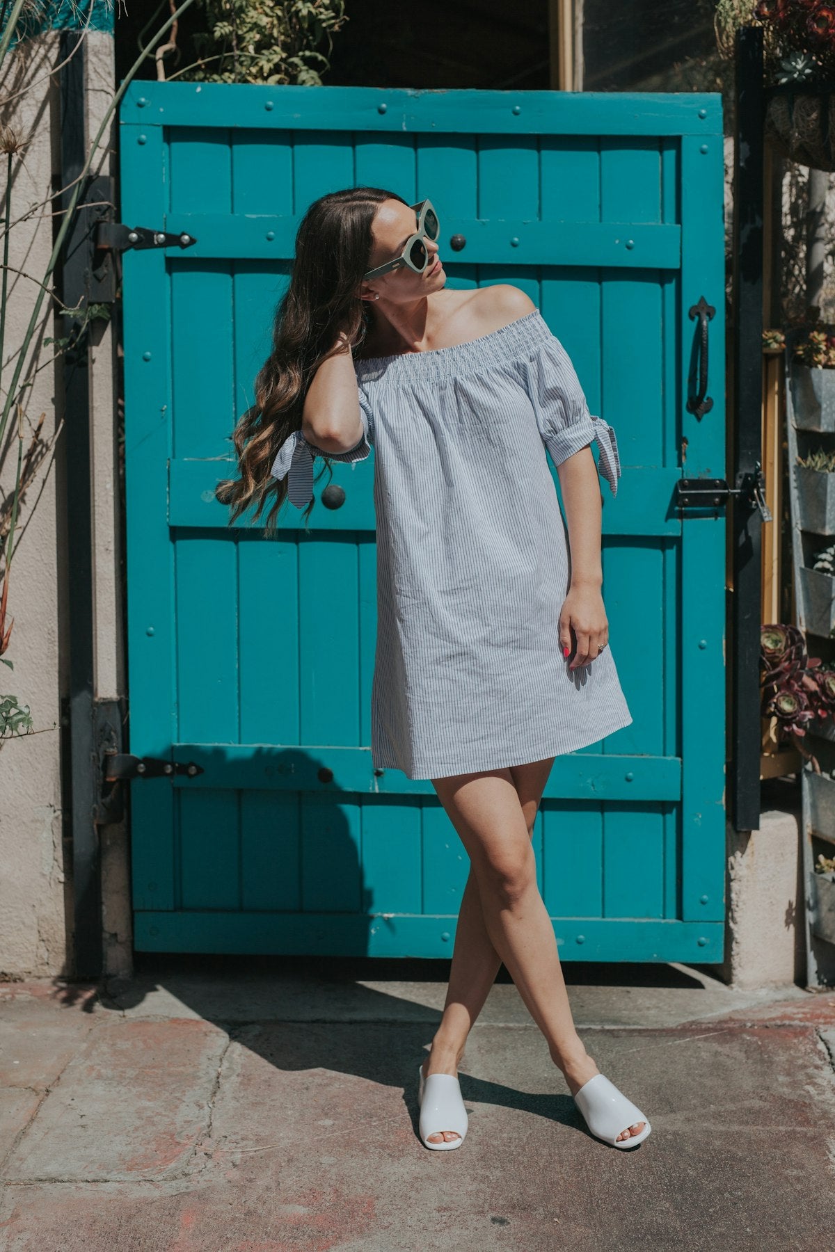 Woman in a casual summer top with a warm, sunlit portrait style — placeholder image