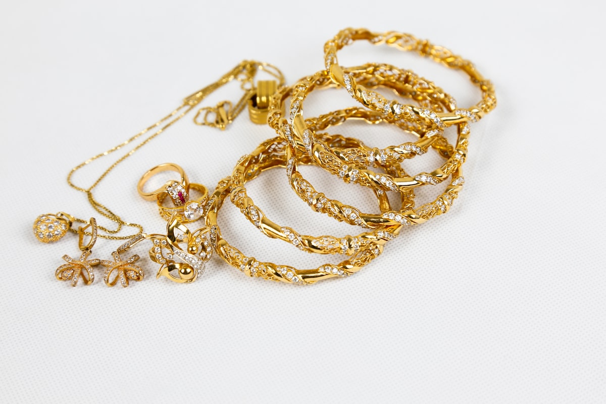 Gold chain necklace laid on a white surface, layered necklace reference — placeholder image
