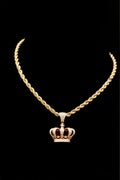 Gold necklace with a crown-shaped pendant, sun-medallion style reference — placeholder image